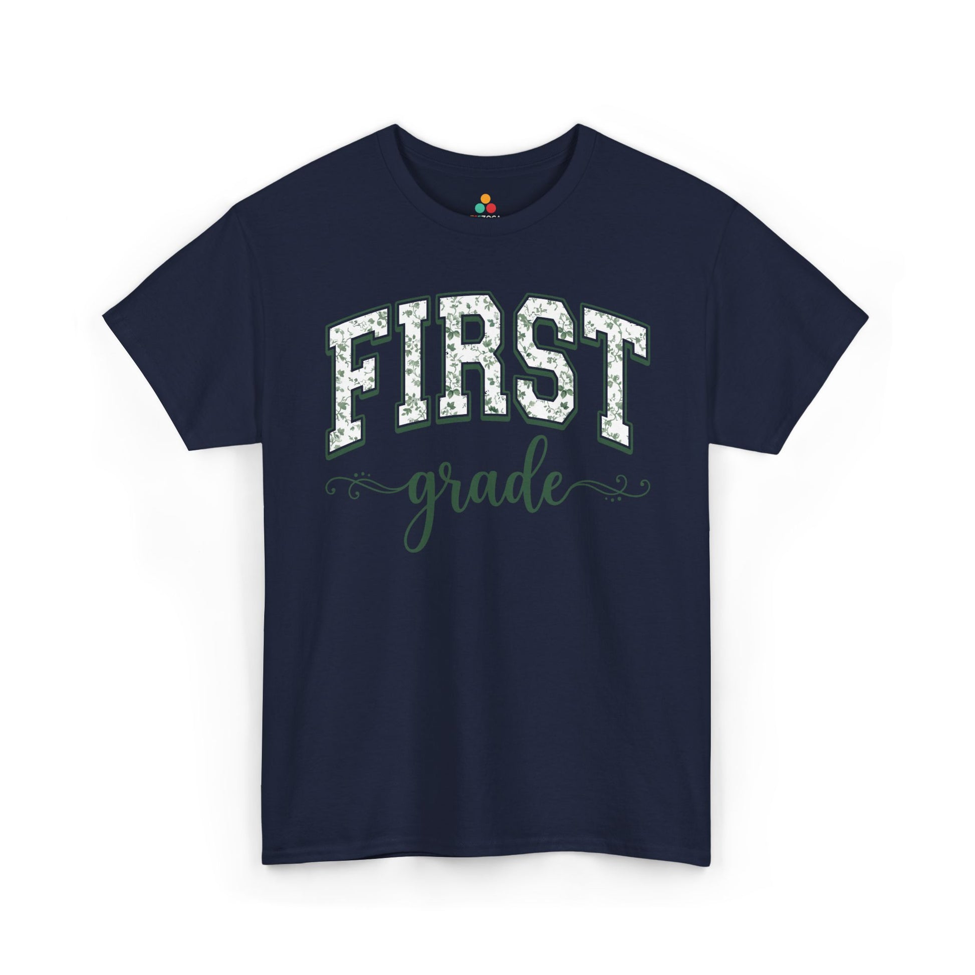 Navy blue t-shirt with 'FIRST grade' text on a white background. Matching first grade shirt by TEEZOCA in sage florals, worn by an adult alongside a new first grader on the first day of school.
