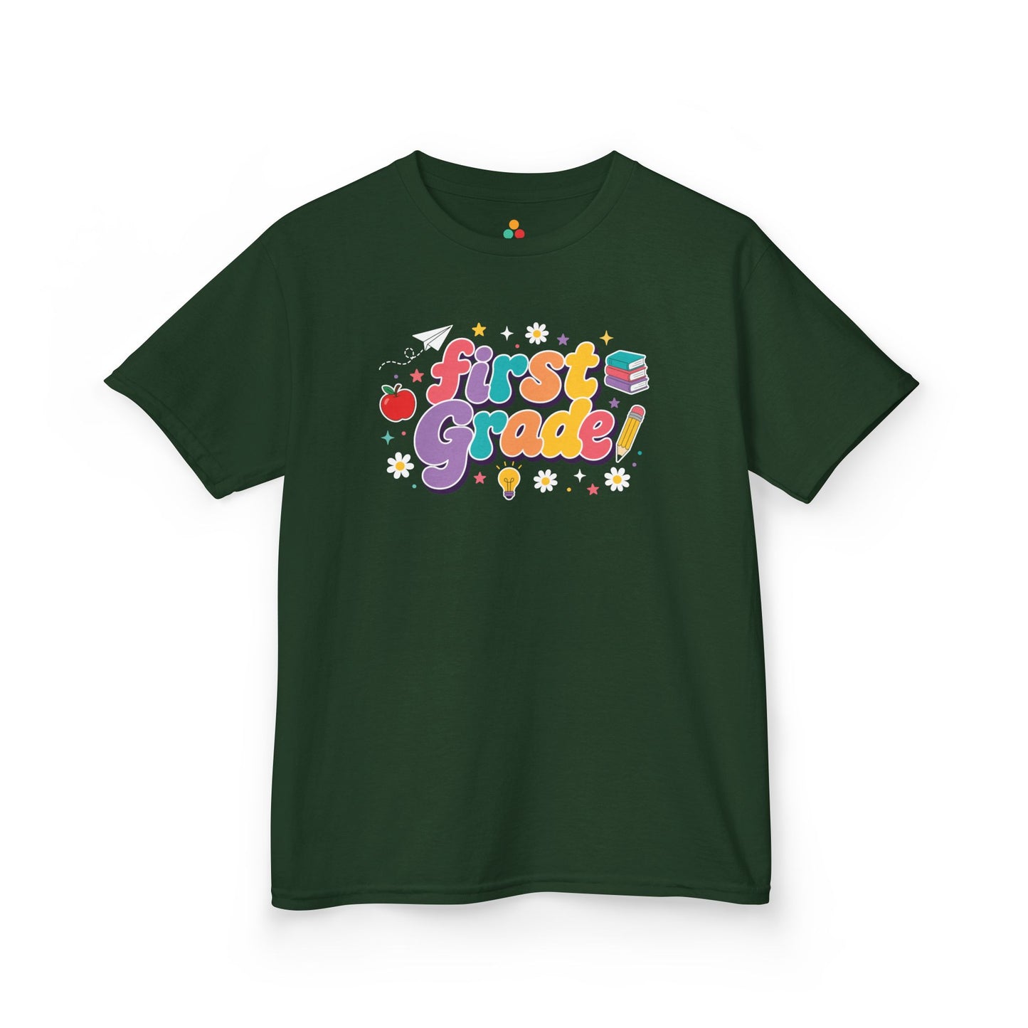 Navy blue t-shirt with 'First Grade!' design on a white background. TEEZOCA t-shirt showing a paper airplane, stars, pencil, apple, and books for a 1st grade shirt for boys.