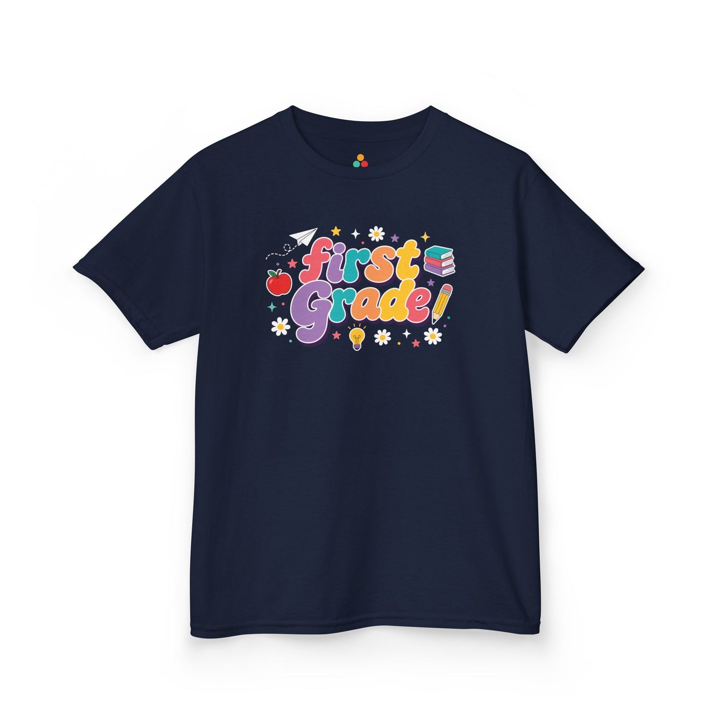 Navy t-shirt with 'First Grade!' design on a white background. TEEZOCA t-shirt with oversized First Grade bubble letters, school icons, daisies, stars, and a playful first grade shirt look.