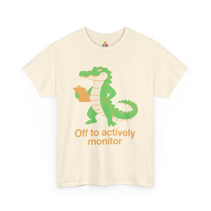 Off to Actively Monitor Funny Test Day School Crocodile T-Shirt – State Testing Gift for Teachers | TEEZOCA Unisex T-shirt made as a funny teacher shirt with an alligator, clipboard, and science classroom humor.
