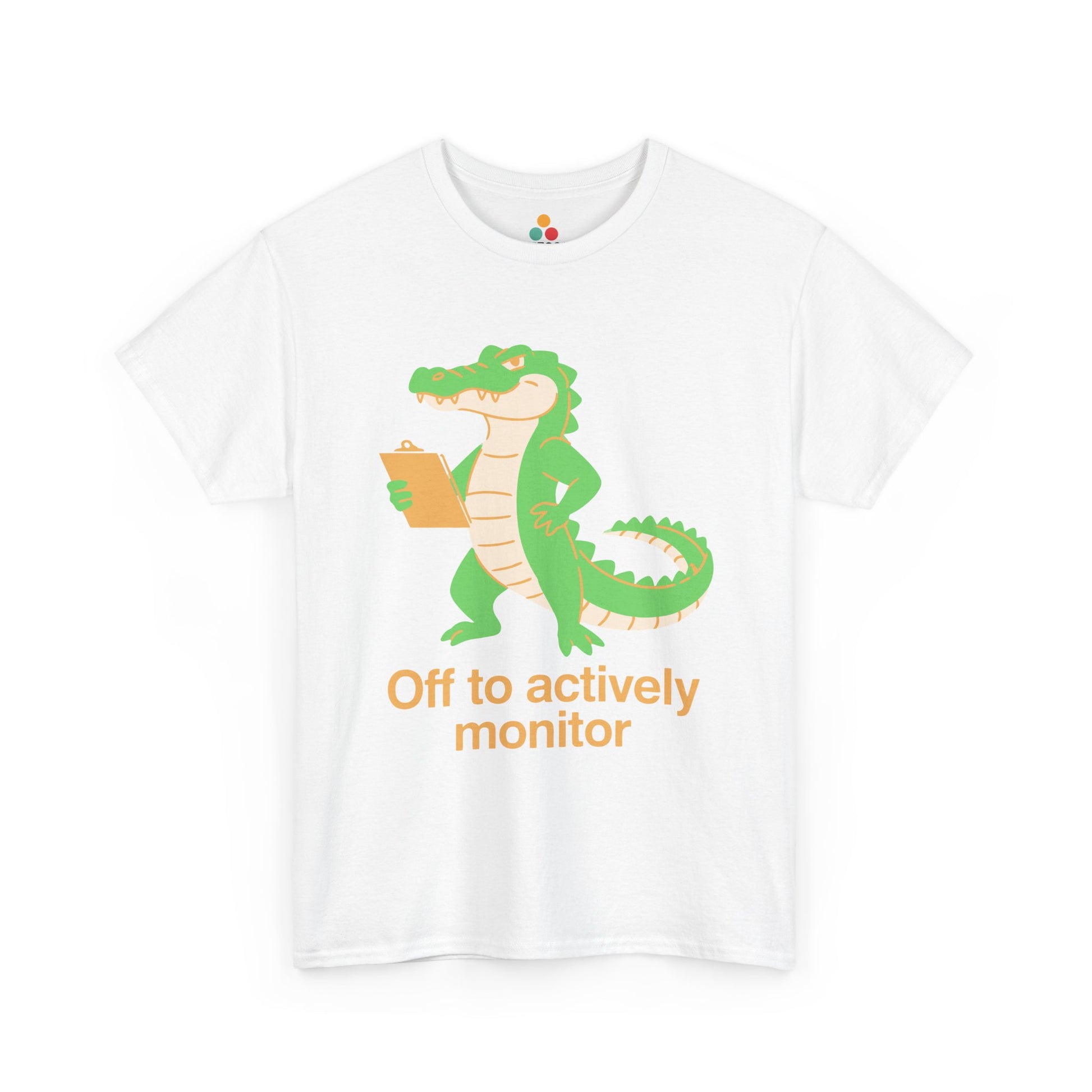 Off to Actively Monitor Funny Test Day School Crocodile T-Shirt – State Testing Gift for Teachers | TEEZOCA Unisex T-shirt with Funny Science Teacher Shirt Off to Actively Monitor design, featuring a green alligator holding a clipboard.
