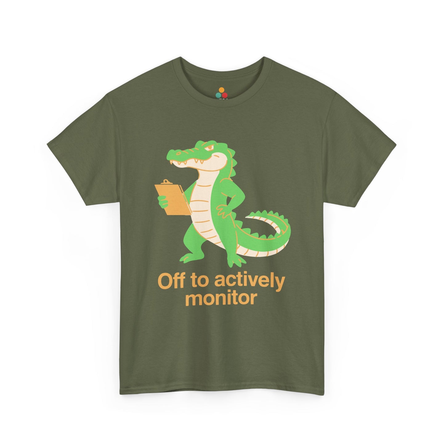 Off to Actively Monitor Funny Test Day School Crocodile T-Shirt – State Testing Gift for Teachers | TEEZOCA t-shirt featuring Funny Science Teacher Shirt Off to Actively Monitor artwork with orange lettering, sparkles, and reptile humor.
