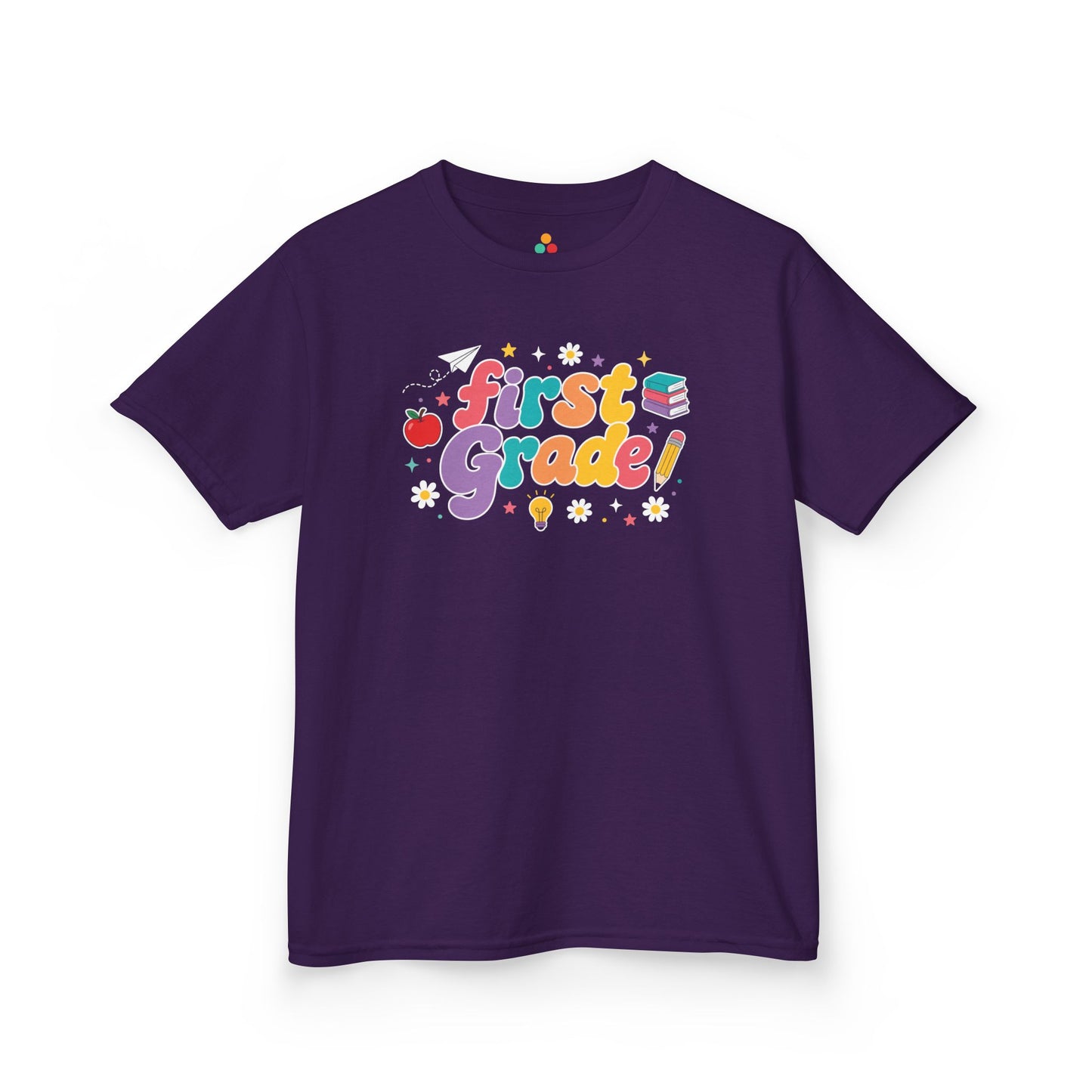 Purple t-shirt with 'first grade!' design on a white background. TEEZOCA t-shirt showing a paper airplane, stars, pencil, apple, and books for a 1st grade shirt for boys.