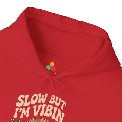 Slow But Vibin Turtle Graphic Unisex Heavy Blend Hoodie | TEEZOCA slow but im vibin slogan Unisex Heavy Blend Hoodie playful design