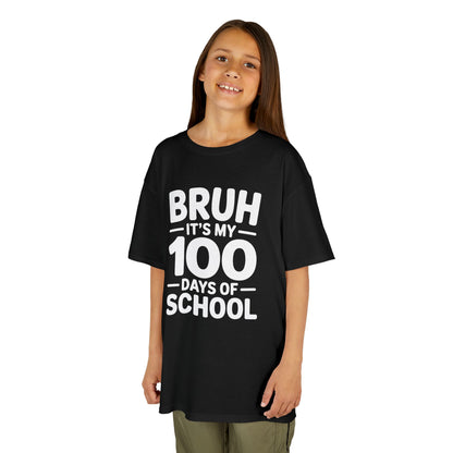 Smiling girl wearing a black TEEZOCA “Bruh It’s My 100 Days Of School” kids t‑shirt.