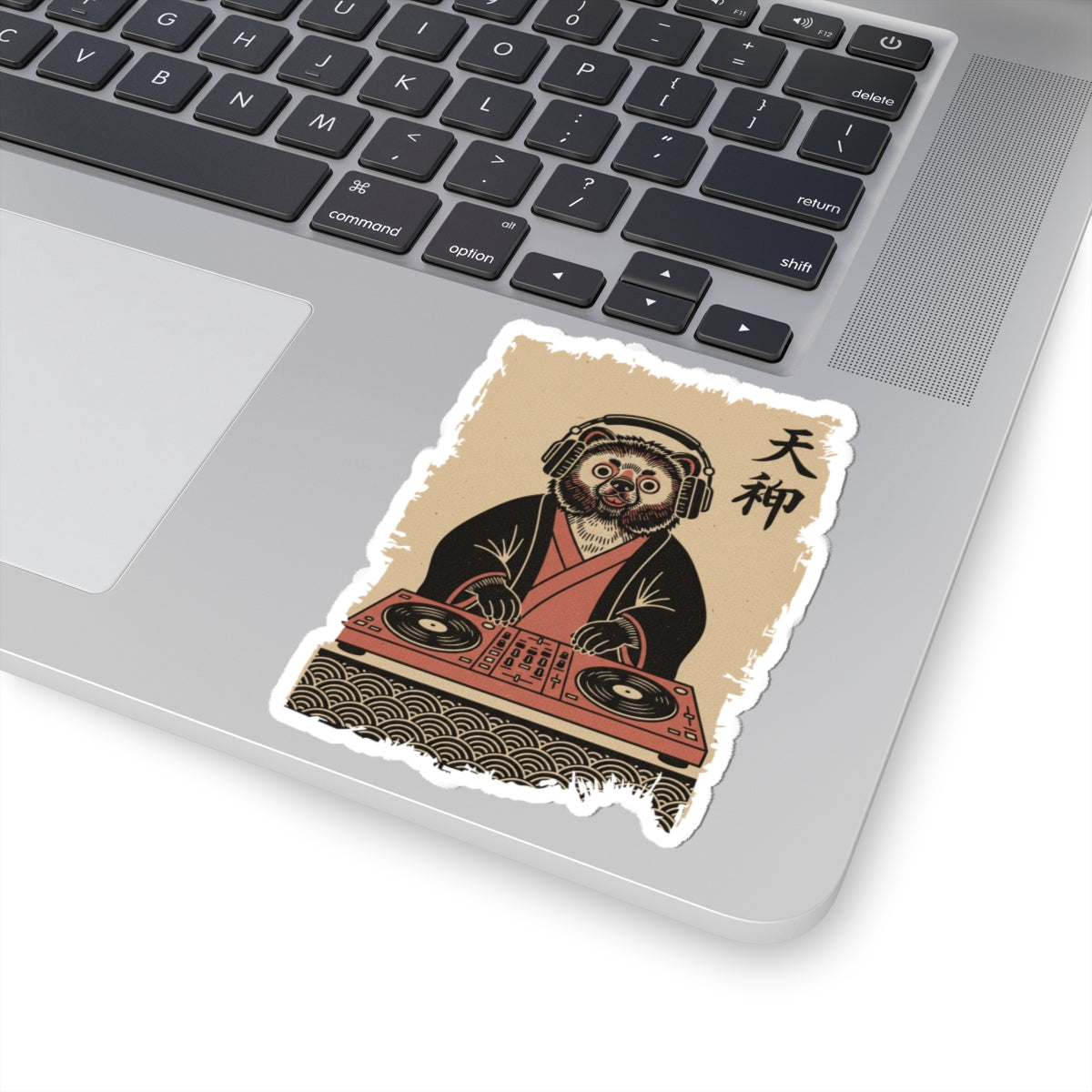 Sticker of a Bear DJ on a laptop