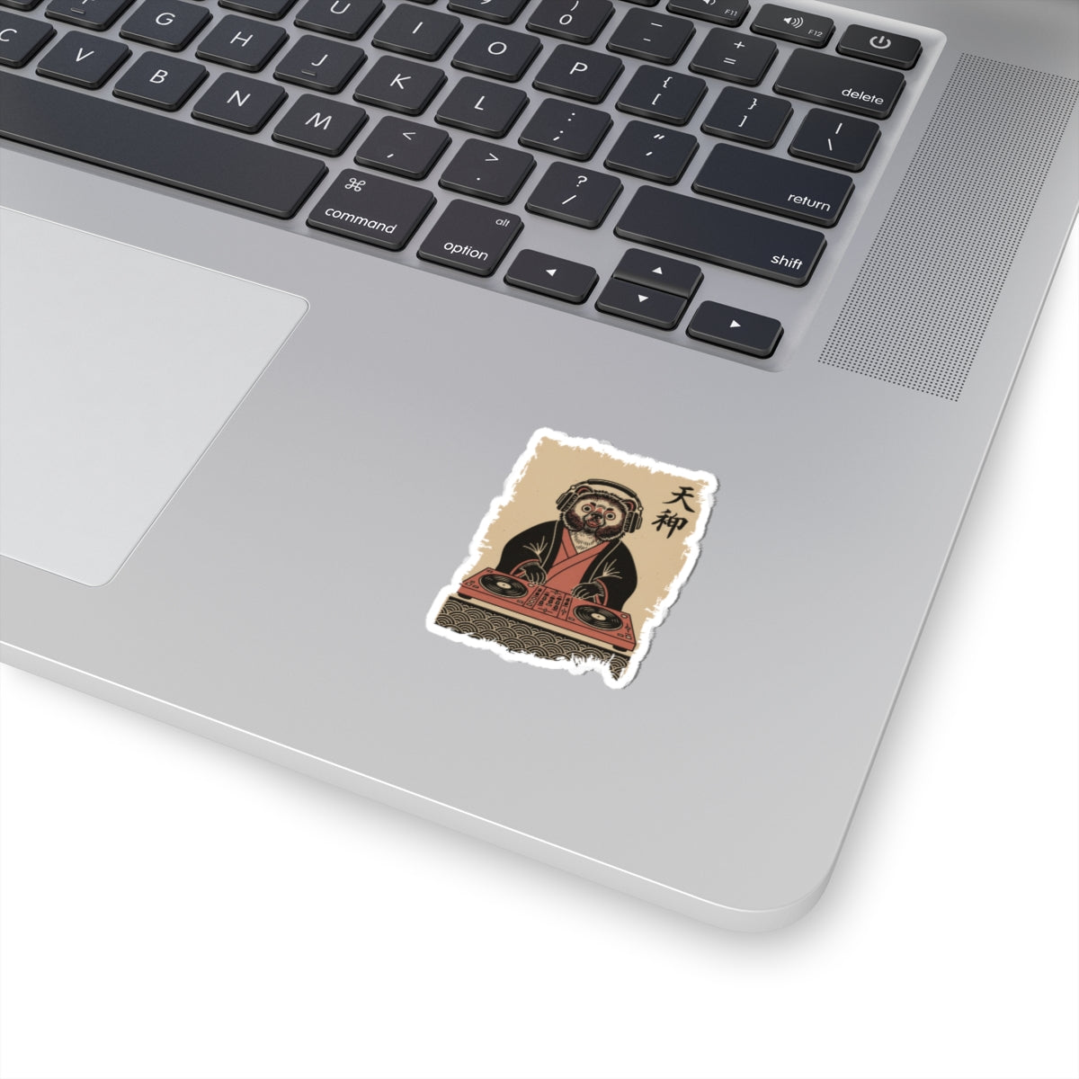 Sticker of a dog DJ on a skateboard deck