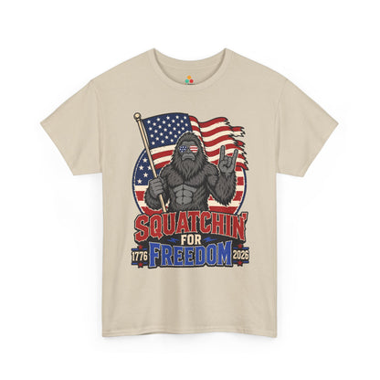 TEEZOCA 4th of July Bigfoot T-shirt showing a Sasquatch with an American flag, freedom lettering, and rugged outdoor style.
