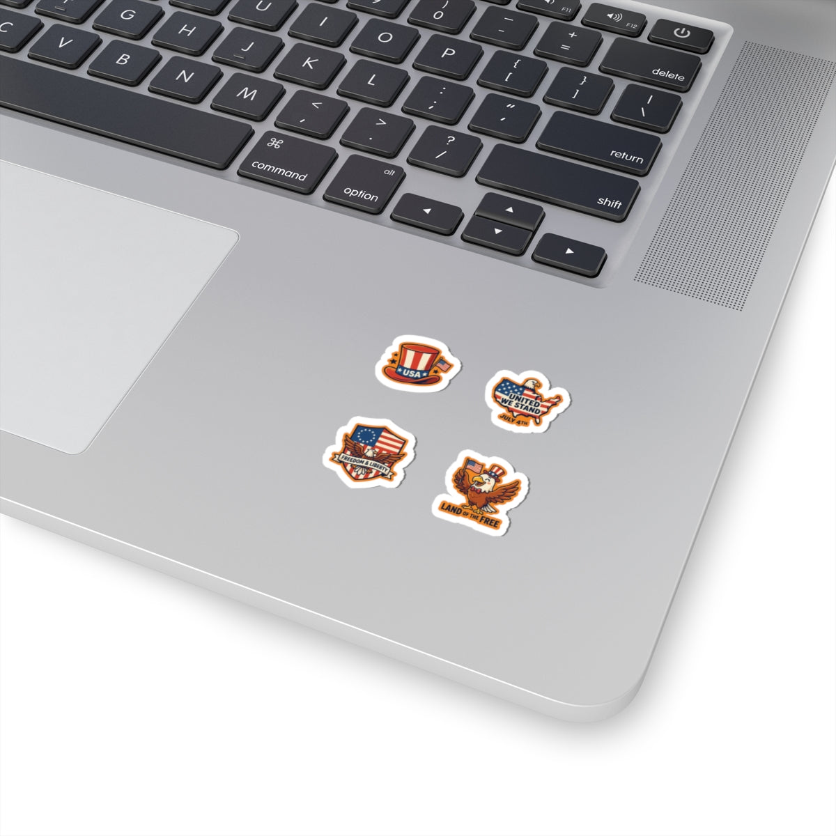 TEEZOCA 4th of July cartoon eagle sticker sheets applied neatly to a silver modern laptop chassis.