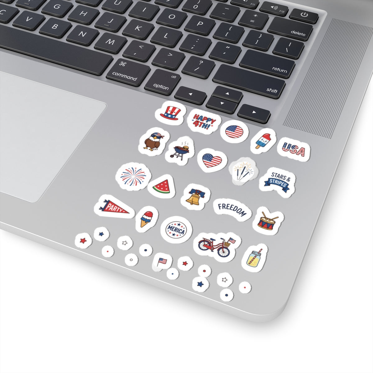 TEEZOCA 4th of July mini sticker sheets applied smoothly to a silver modern laptop chassis surface.