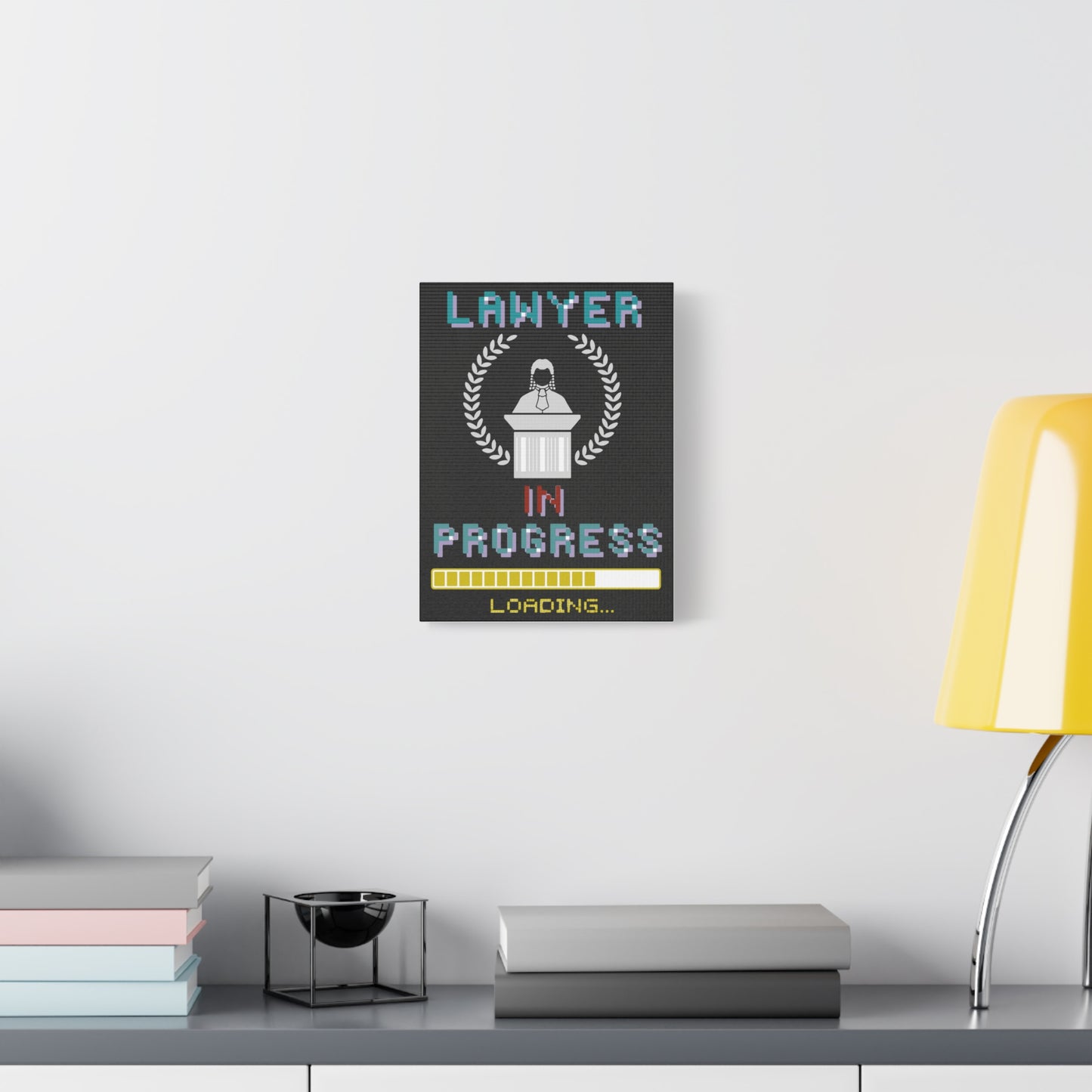 TEEZOCA “Lawyer in Progress Loading” canvas hanging above a couch with yellow lamp.