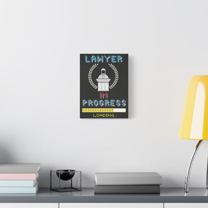 TEEZOCA “Lawyer in Progress Loading” canvas hanging above a couch with yellow lamp.