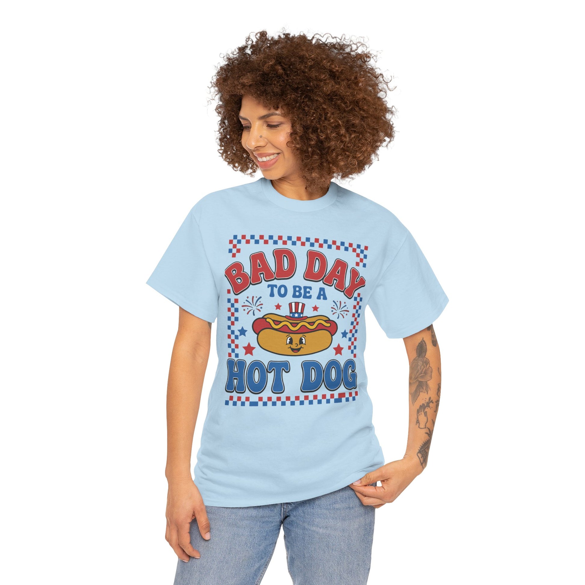 TEEZOCA bad day to be a hot dog shirt T-shirt with retro lettering, smiling hot dog, Uncle Sam hat, fireworks, and checkered border.

