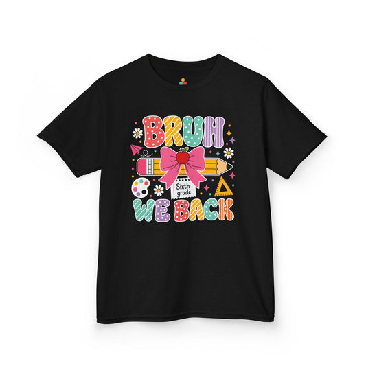 TEEZOCA black Bruh We Back Sixth Grade kids shirt laid flat, colorful lettering with a bow-topped pencil and apple, a funny back to school tee.
