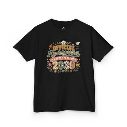 TEEZOCA black Future Class of 2039 kids shirt laid flat, boho Official Kindergartener lettering with a floral wreath, a keepsake back to school tee.
