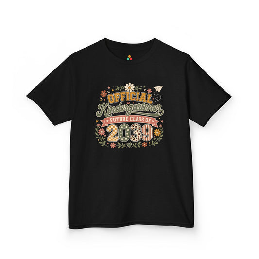 TEEZOCA black Future Class of 2039 kids shirt laid flat, boho Official Kindergartener lettering with a floral wreath, a keepsake back to school tee.
