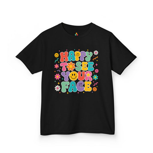 TEEZOCA black Happy to See Your Face kids shirt laid flat, groovy retro bubble lettering with cheerful faces and daisies, a cute back to school tee.
