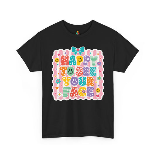 TEEZOCA black Happy to See Your Face shirt laid flat, cute coquette lettering with a bow and cheerful faces, a cute teacher back to school tee.
