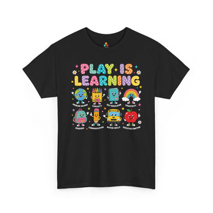 TEEZOCA black Play Is Learning shirt laid flat, bright lettering with friendly school-supply characters, a cute teacher back to school tee.
