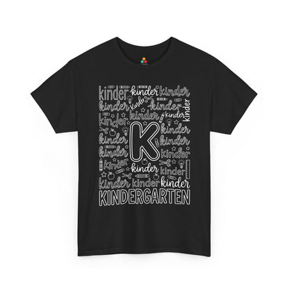 TEEZOCA black kindergarten teacher shirt laid flat, bold typography word art with pencil, apple, and crayon doodles, a cute back to school tee.
