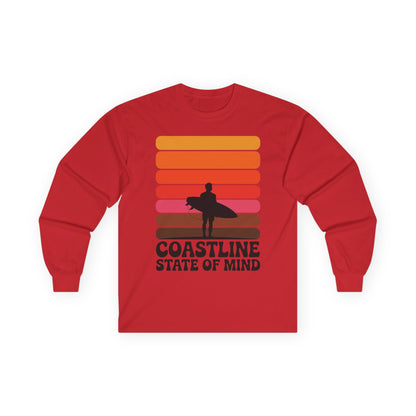 TEEZOCA coastline state of mind surf unisex long-sleeve t-shirt Red long-sleeve shirt with a graphic design of a person holding a surfboard and sunset colors, on a white background.