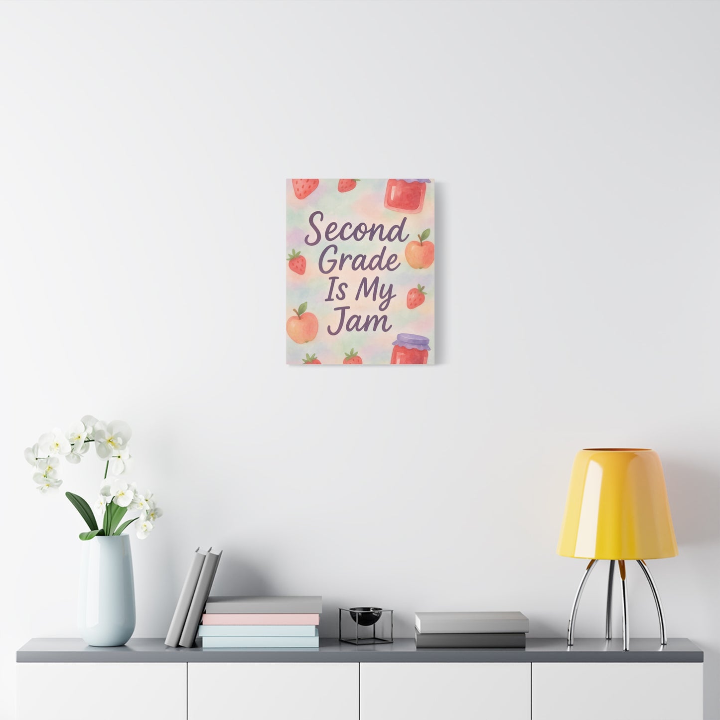 TEEZOCA colorful “Second Grade Is My Jam” canvas displayed over a low console with decor.