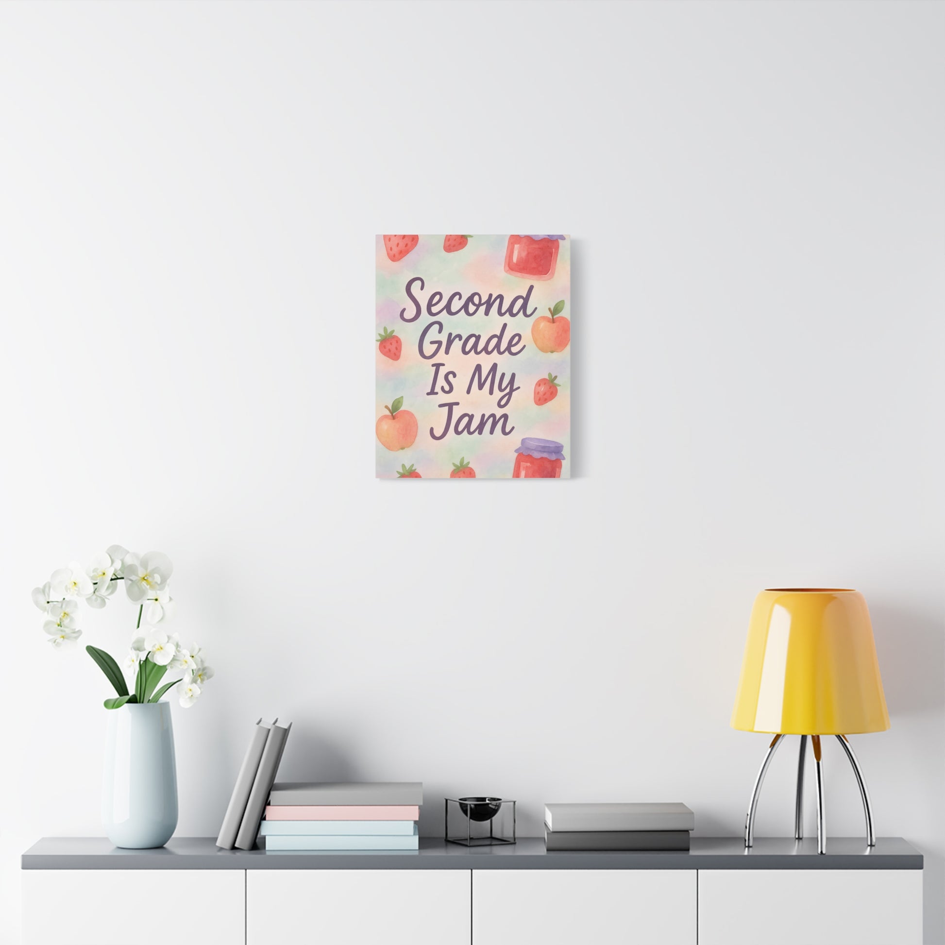 TEEZOCA colorful “Second Grade Is My Jam” canvas displayed over a low console with decor.