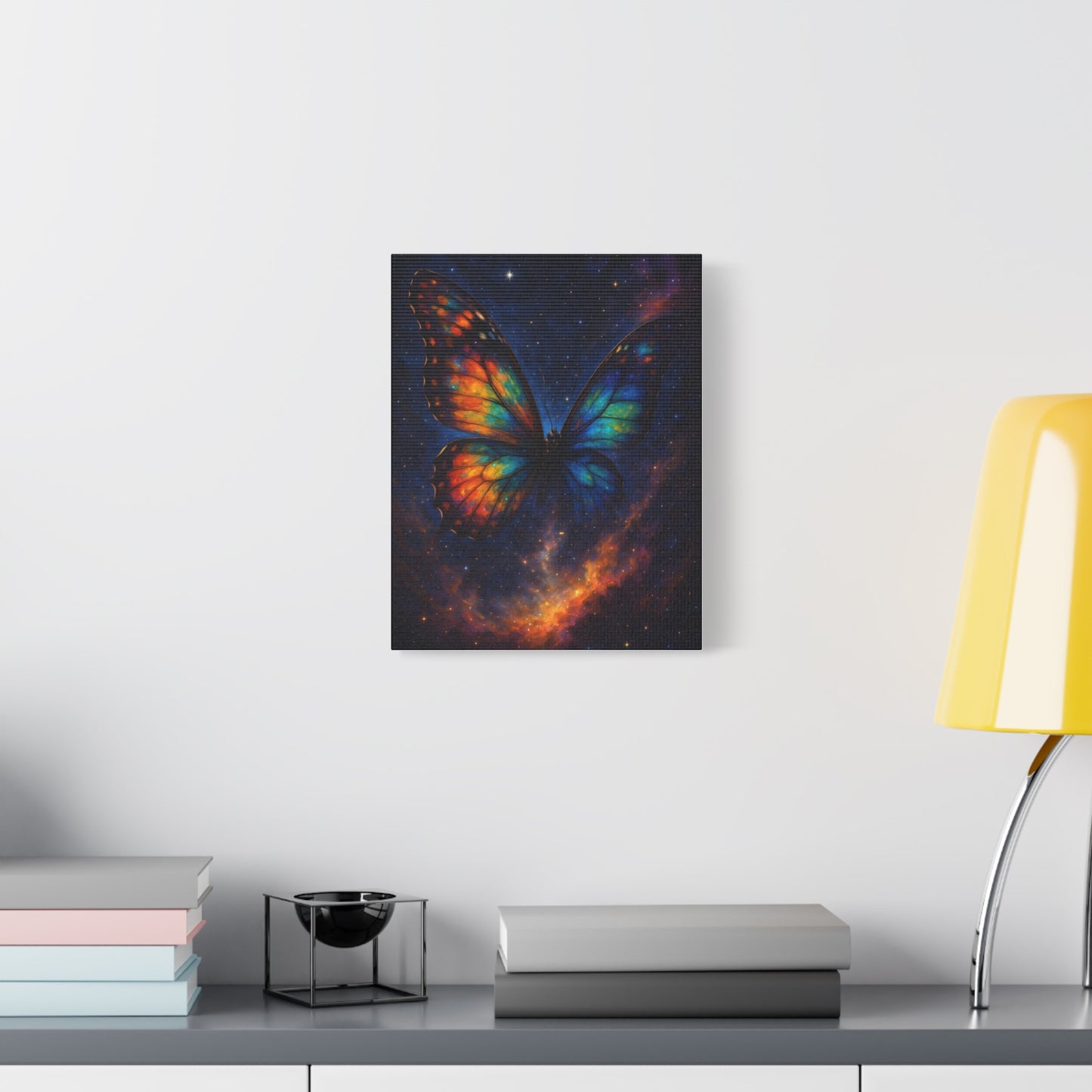 TEEZOCA cosmic butterfly canvas hanging above a minimalist couch in a bright living room.