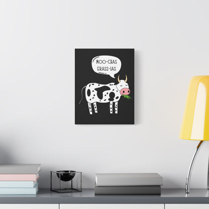 TEEZOCA cow pun canvas hanging above a minimalist couch in a bright living room.