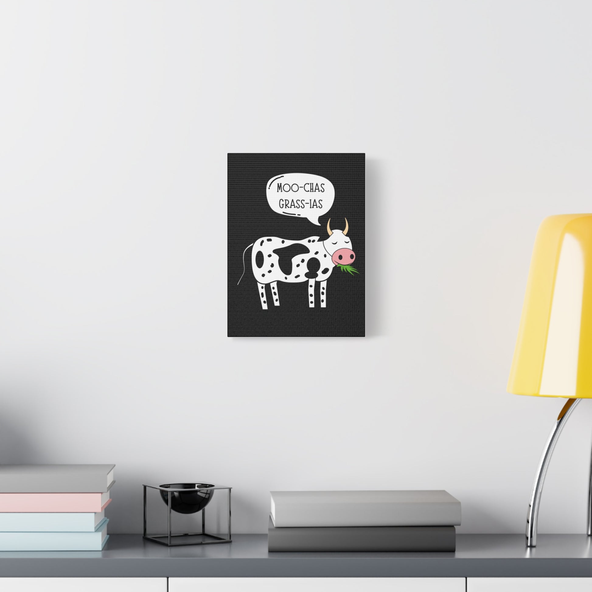 TEEZOCA cow pun wall art in a clean white room with plant and console.