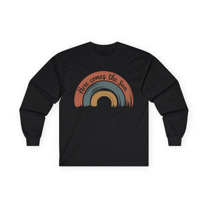 TEEZOCA here comes the sun positive rainbow graphic on unisex long-sleeve t-shirt Black long-sleeve shirt with a rainbow design and 'Here comes the sun' text on a white background