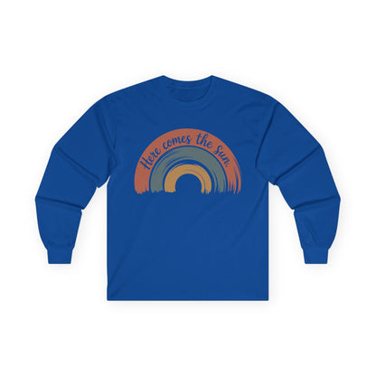 TEEZOCA here comes the sun retro rainbow art on unisex long-sleeve t-shirt Blue long-sleeve shirt with rainbow design and text on a white background