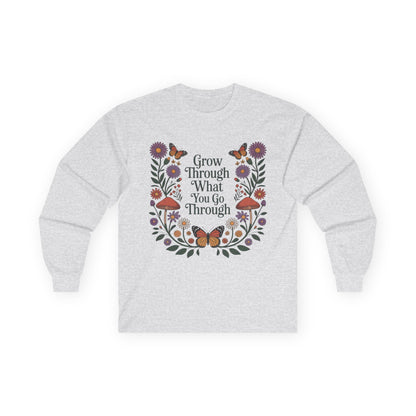 TEEZOCA inspirational grow through what you go through graphic on unisex long-sleeve t-shirt Gray sweatshirt with floral design and motivational quote on a white background