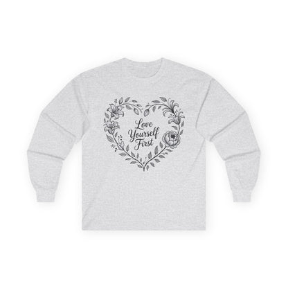 TEEZOCA love yourself first floral heart design on unisex long-sleeve t-shirt Gray sweatshirt with floral heart design and 'Love Yourself First' text on a white background