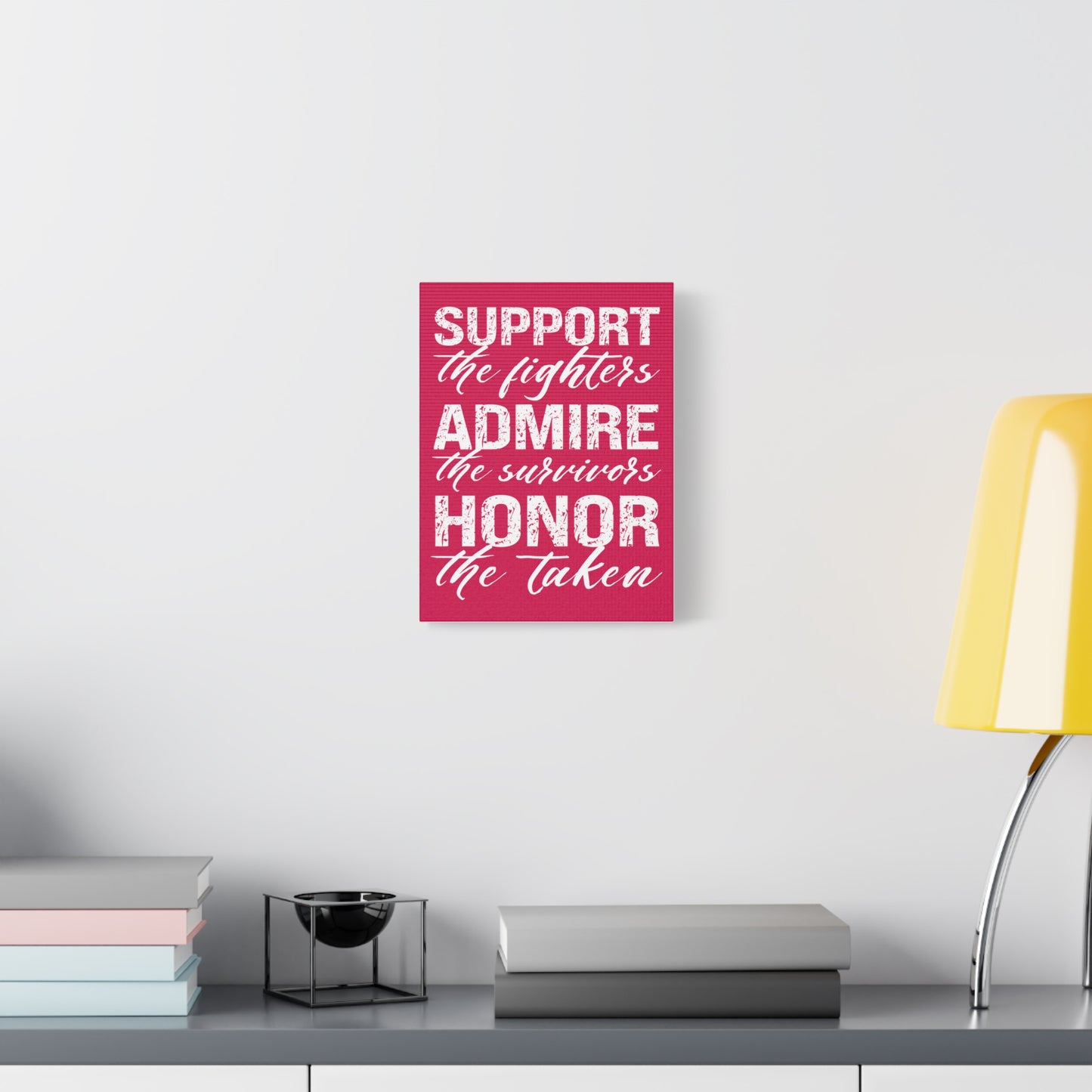 TEEZOCA motivational pink awareness quote wall art in a clean white room with plant and console.