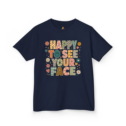TEEZOCA navy Happy to See Your Face kids shirt laid flat, boho lettering with mixed vintage patterns and daisies, a cute back to school tee.
