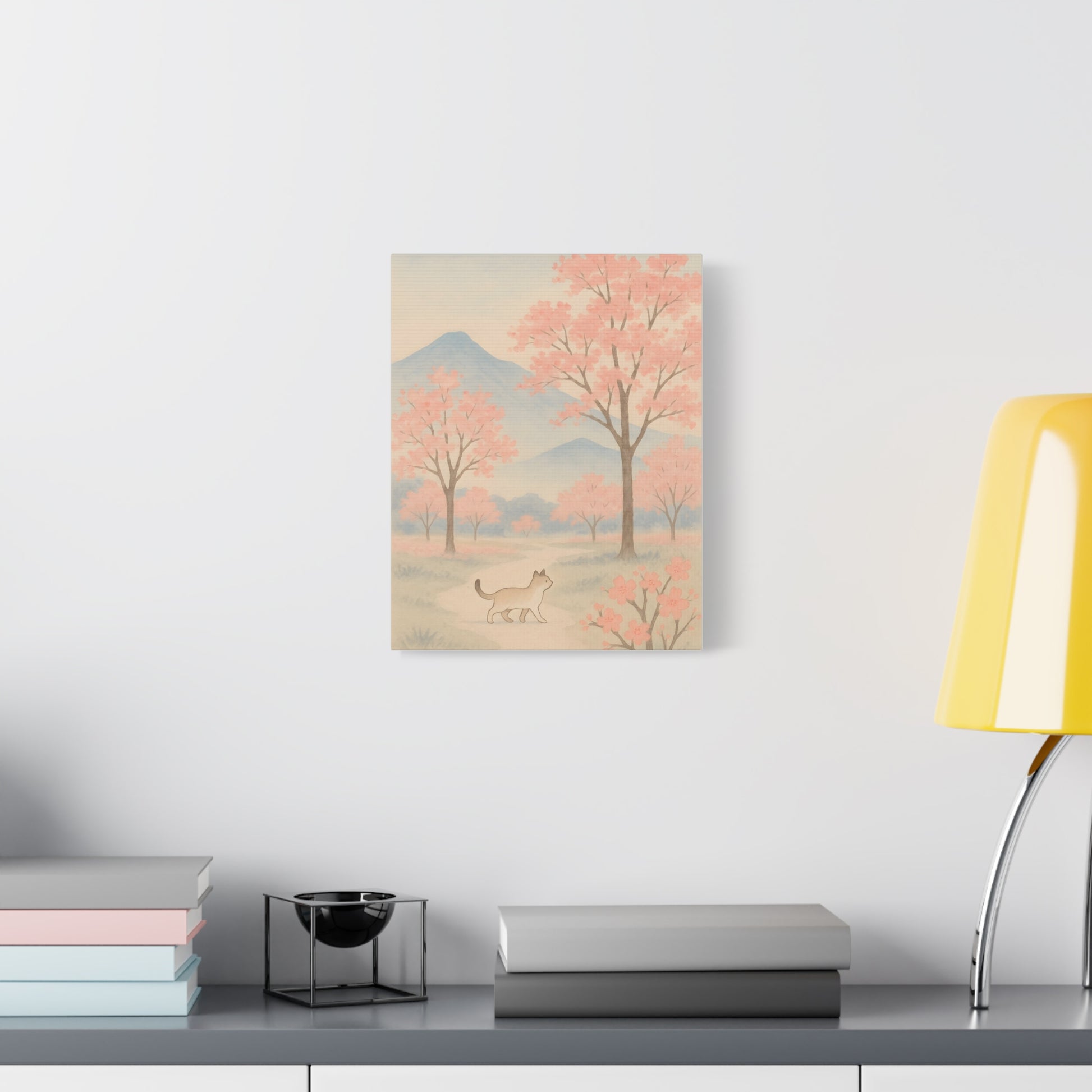 TEEZOCA pastel mountain and cherry blossom cat print hanging in a cozy home office corner.