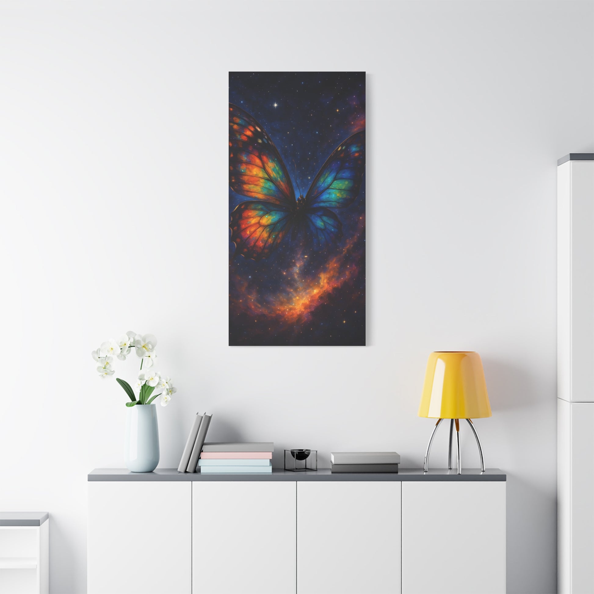 TEEZOCA rainbow‑wing butterfly galaxy wall art in a clean white room with plant and console.