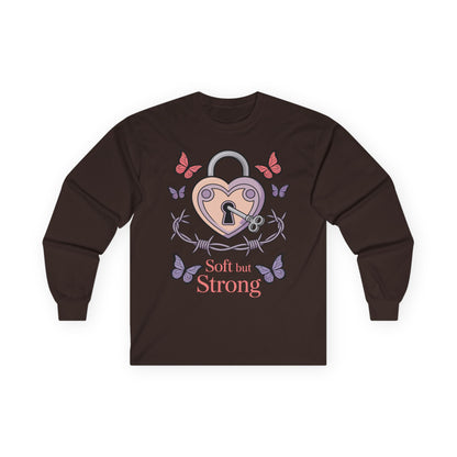 TEEZOCA soft but strong butterfly heart illustration on unisex long-sleeve t-shirt Brown long-sleeve shirt with heart and lock design and 'Soft but Strong' text on a white background