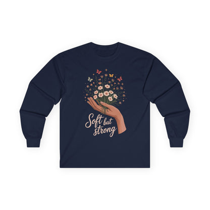 TEEZOCA soft but strong floral artwork on unisex long-sleeve t-shirt Navy blue long-sleeve shirt with floral design and 'Soft but Strong' text on a white background