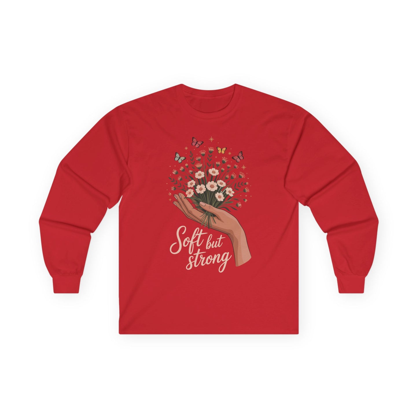 TEEZOCA soft but strong floral artwork on unisex long-sleeve t-shirt Red long-sleeve shirt with a graphic of a hand holding flowers and text 'Soft but Strong' on a white background.
