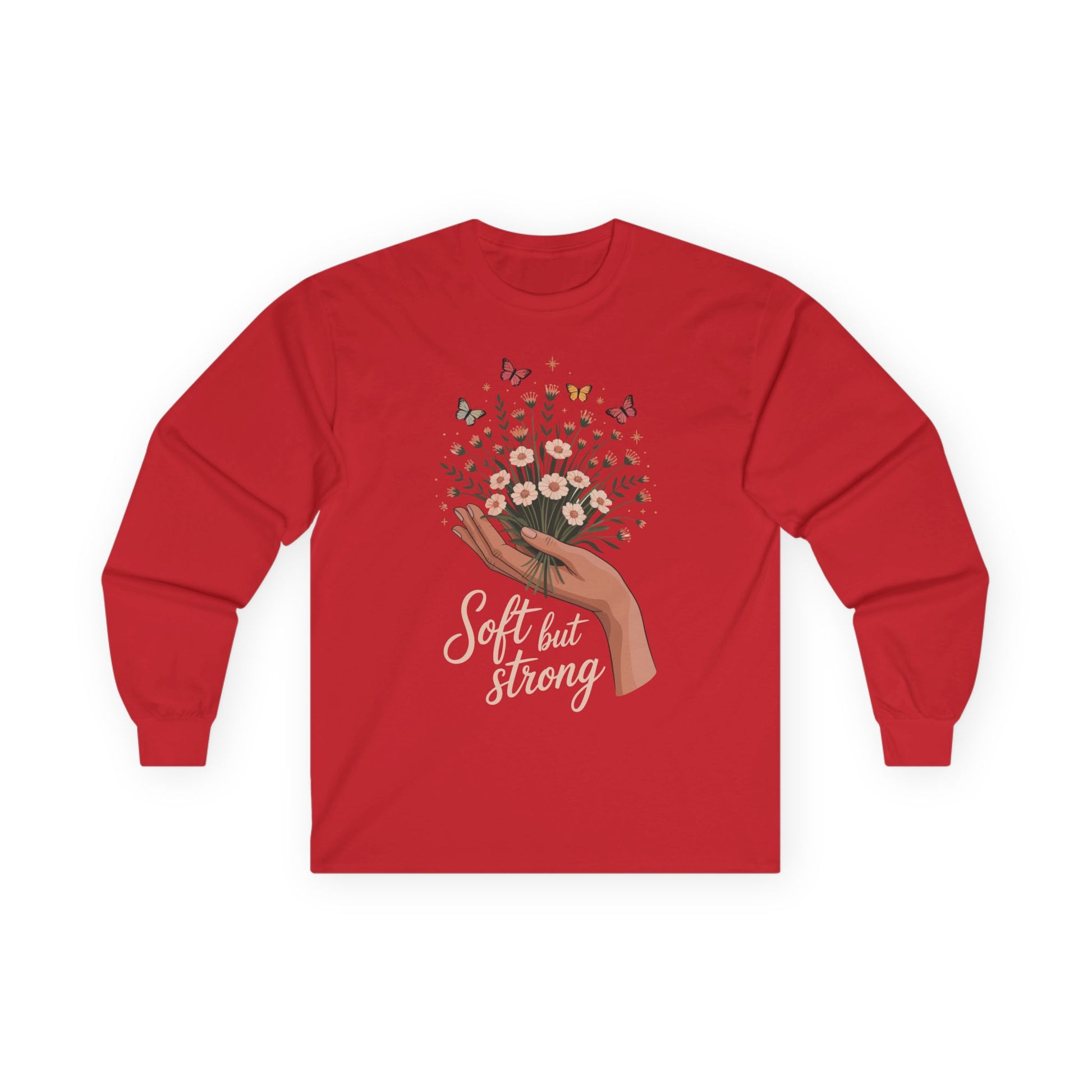 TEEZOCA soft but strong floral artwork on unisex long-sleeve t-shirt Red long-sleeve shirt with a graphic of a hand holding flowers and text 'Soft but Strong' on a white background.