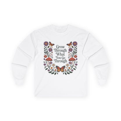 TEEZOCA unisex long-sleeve t-shirt featuring grow through what you go through artwork White sweatshirt with floral design and motivational quote on a white background