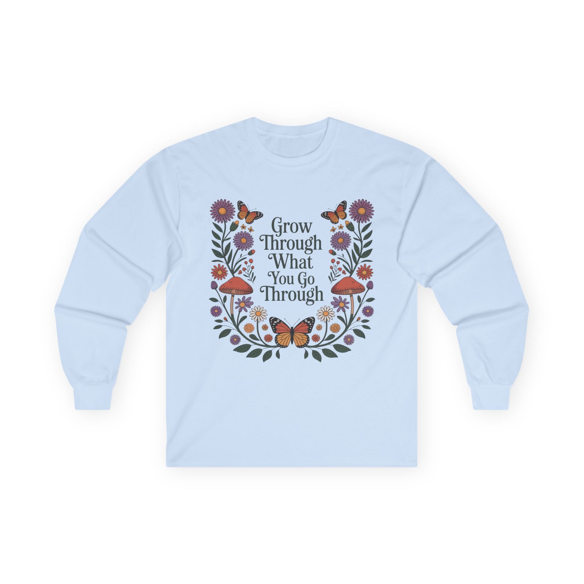 TEEZOCA unisex long-sleeve t-shirt with grow through what you go through botanical frame Light blue sweatshirt with floral design and motivational text on a white background
