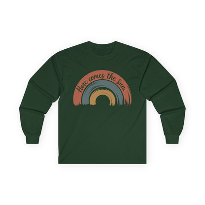 TEEZOCA unisex long-sleeve t-shirt with here comes the sun inspirational design Green long-sleeve shirt with rainbow design and 'Here comes the sun' text on a white background