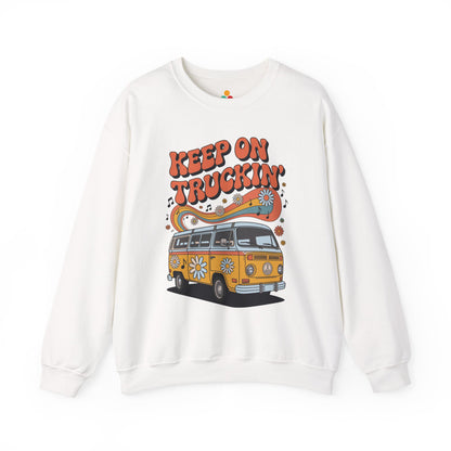 TEEZOCA unisex sweatshirt featuring a retro van with daisies, rainbow waves, music notes, and “Keep On Truckin’” vintage typography White sweatshirt with a graphic of a van and 'Keep on Truckin'' text on a white background