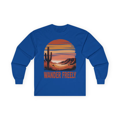 TEEZOCA wander freely cactus and sunset artwork on unisex long-sleeve t-shirt Blue long-sleeve shirt with a desert landscape graphic and 'Wander Freely' text on a white background