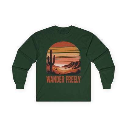 TEEZOCA wander freely desert sunset design on unisex long-sleeve t-shirt Green long-sleeve shirt with a desert landscape graphic and 'Wander Freely' text on a white background
