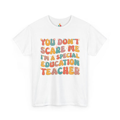 TEEZOCA white T-shirt featuring retro groovy "You Don't Scare Me I'm A Special Education Teacher" text with boho daisy flowers shown flat.