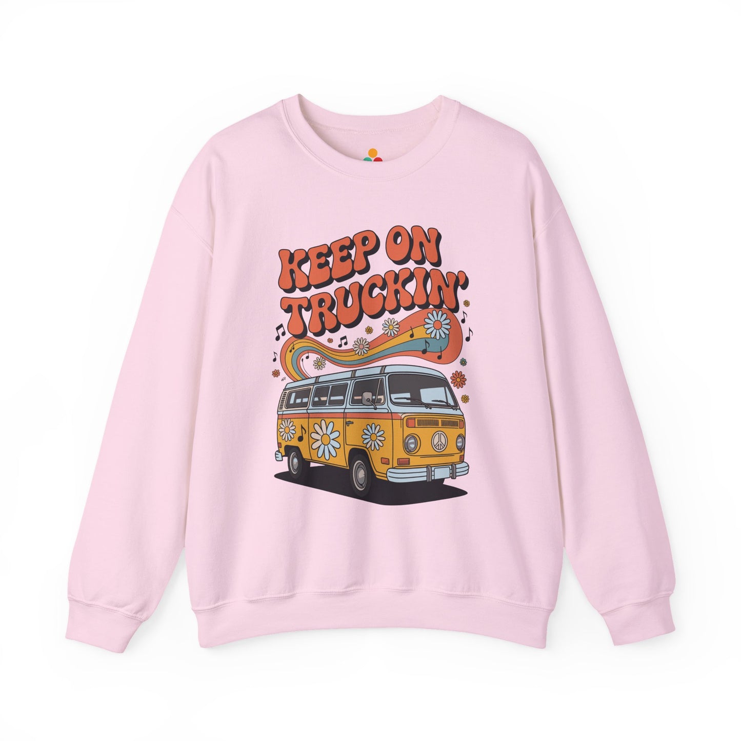 Unisex Heavy Blend crewneck sweatshirt by TEEZOCA with retro van illustration, 70s vibe typography, flowers, and music notes Pink sweatshirt with a graphic of a van and 'Keep on Truckin'' text on a white background